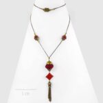 Sautoir pendentif bola en fibres végétales — Riad à Marrakech Zor Paris